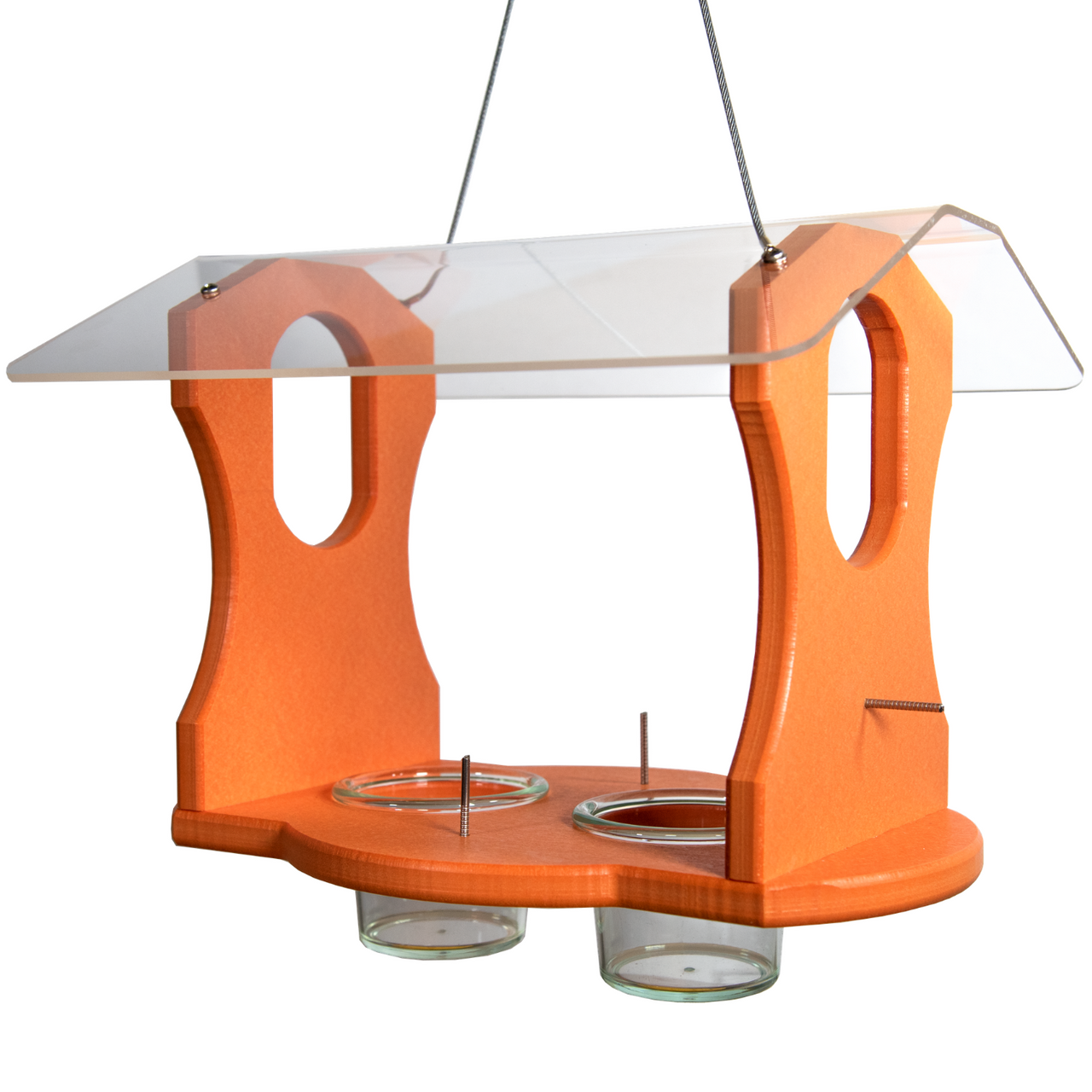 Wooden bird feeder with clear acrylic roof two glass cups and bright orange finish hanging against white background