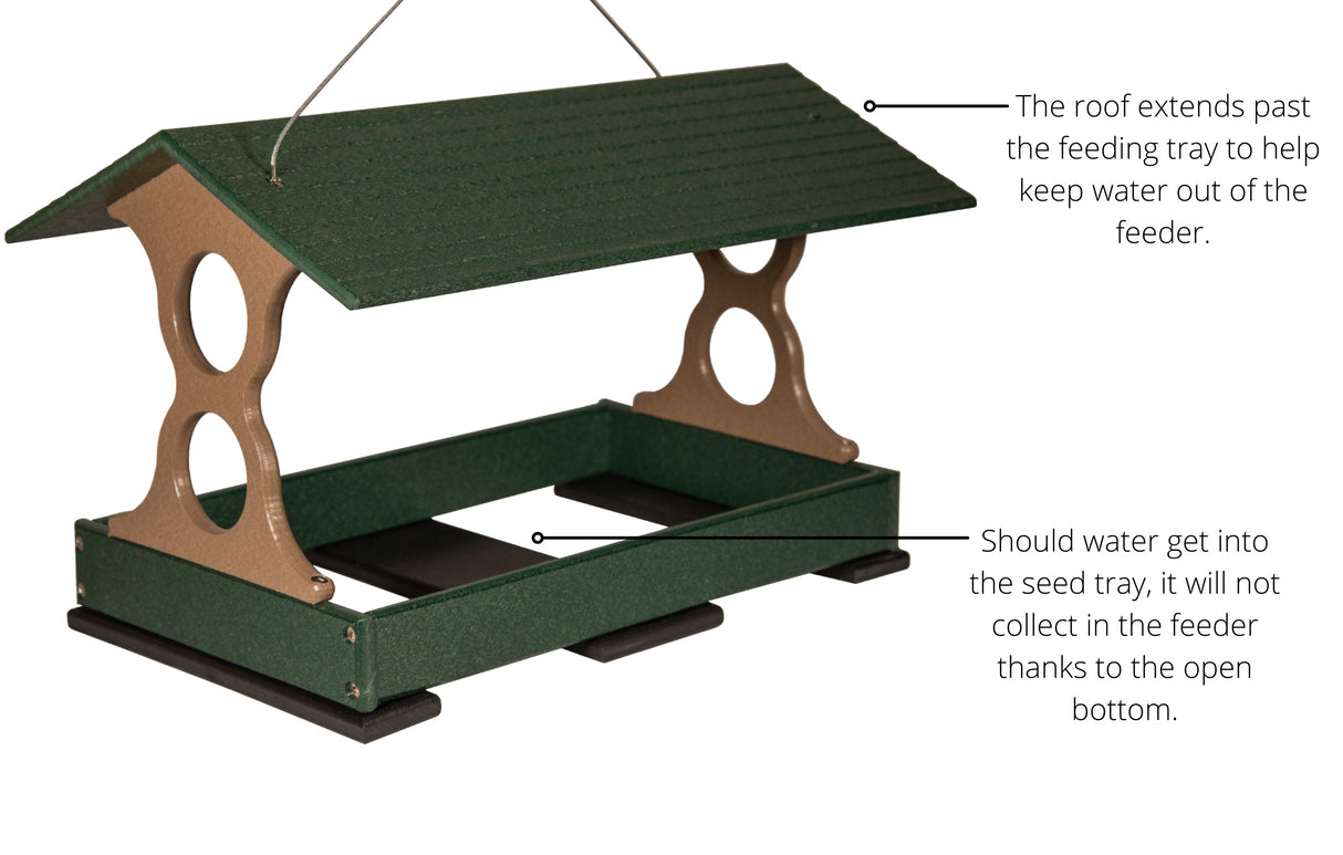 Recycled plastic bird feeder with a dark green roof, taupe accents, and an open bottom tray for drainage