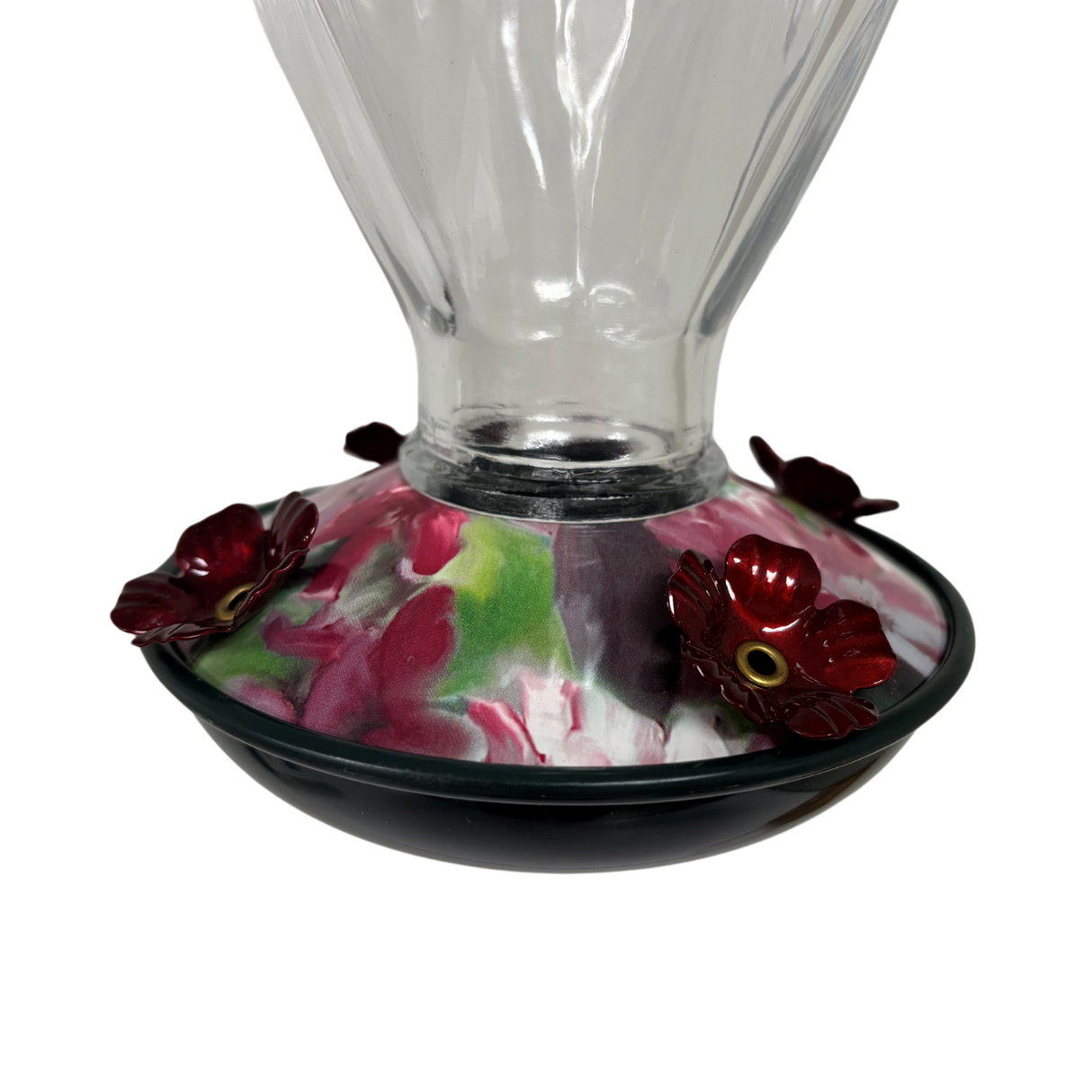 Glass hummingbird feeder with a dark green base and a floral design featuring deep crimson and pale pink flowers and accents of green