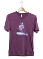 Canvas t-shirt featuring a white ink drawing of a cardinal perched on a branch with textured details and subtle shading on a maroon shirt