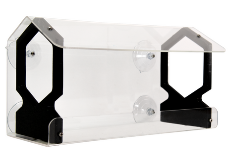 Acrylic bird feeder with black accents and suction cups attached to a window four suction cups and a clear acrylic body showcasing sleek design