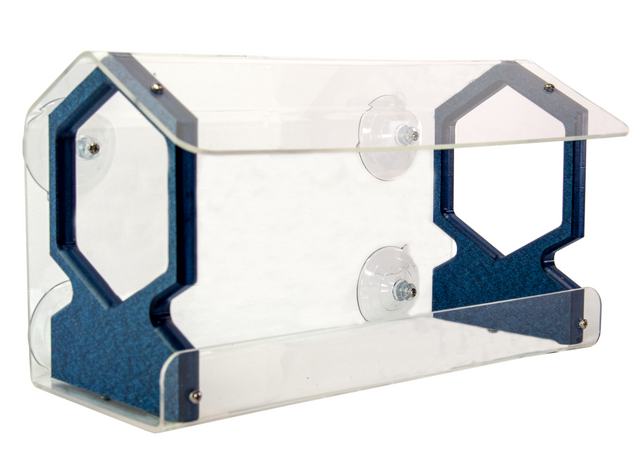 Acrylic bird feeder with dark blue hexagonal accents and clear suction cups attached to a window showcasing a modern design