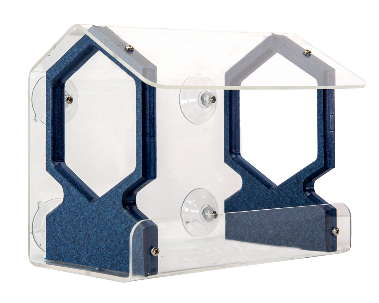 Acrylic bird feeder with suction cups a clear acrylic body and dark blue textured accents showing a house-shaped design