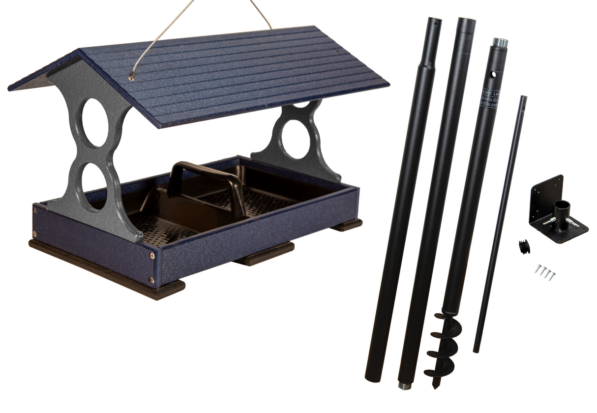 Product shot showing a dark blue and gray plastic bird feeder with a sloped roof and a removable tray on a white background along with its black metal ground post and hardware featuring a textured surface rubber feet and a hanging wire