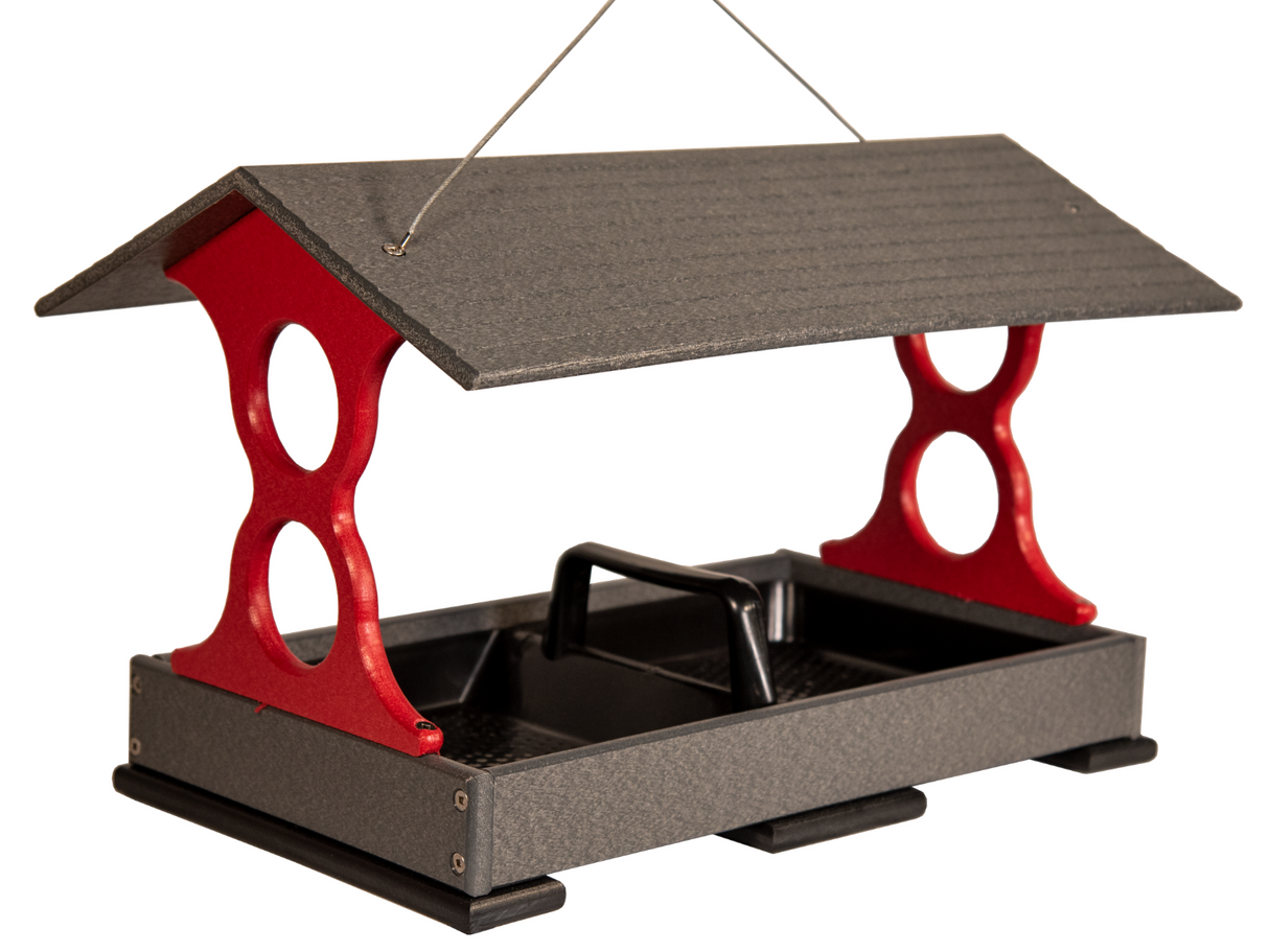 Recycled plastic bird feeder with a gray roof and red accents showing a tray with a black divider and hanging wire.