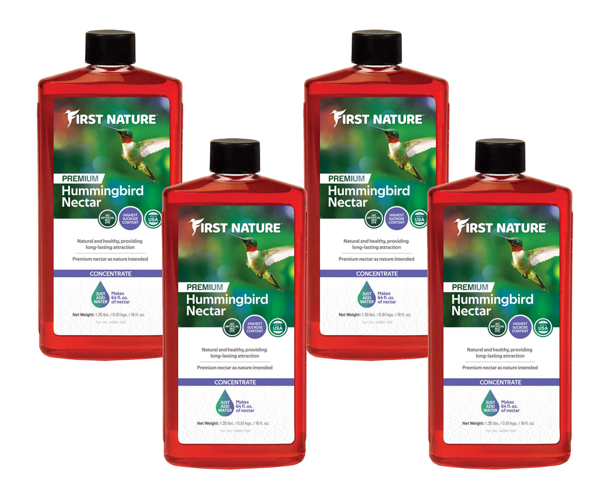 Four bottles of First Nature 3050 Red Hummingbird Nectar Concentrate 16 oz., perfect for feeding hummingbirds.
