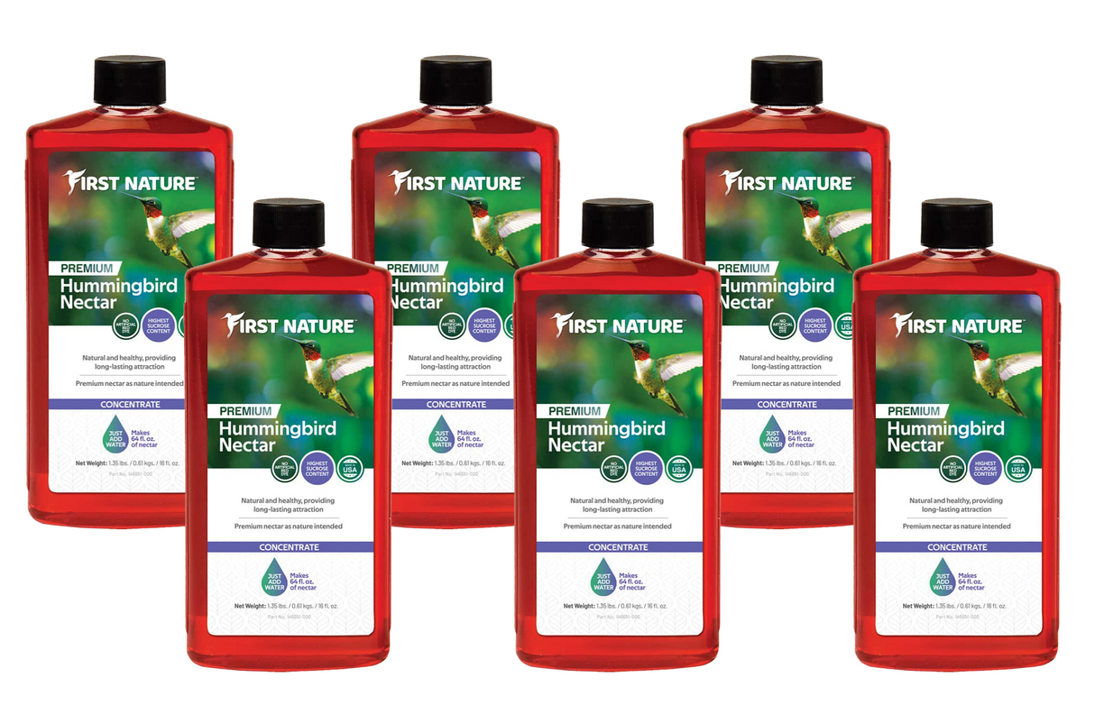 First Nature 3050 Red Hummingbird Nectar Concentrate 16 oz bottles in a pack of 6, ideal for attracting hummingbirds.