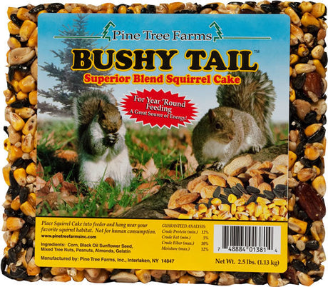 Pine Tree Farms Bushy Tail Superior Blend Squirrel Cake featuring a gray squirrel on a log surrounded by corn black oil sunflower seeds and almonds in a vibrant yellow and blue package