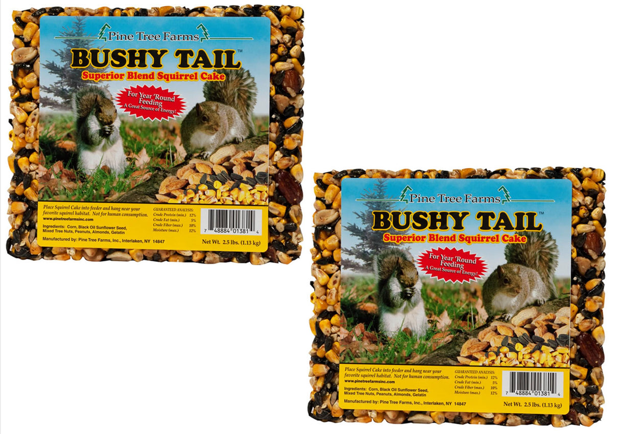 Pine Tree Farms photograph of two packages of Bushy Tail Superior Blend Squirrel Cake showing a squirrel in its natural habitat with corn, black oil sunflower seeds, and almonds