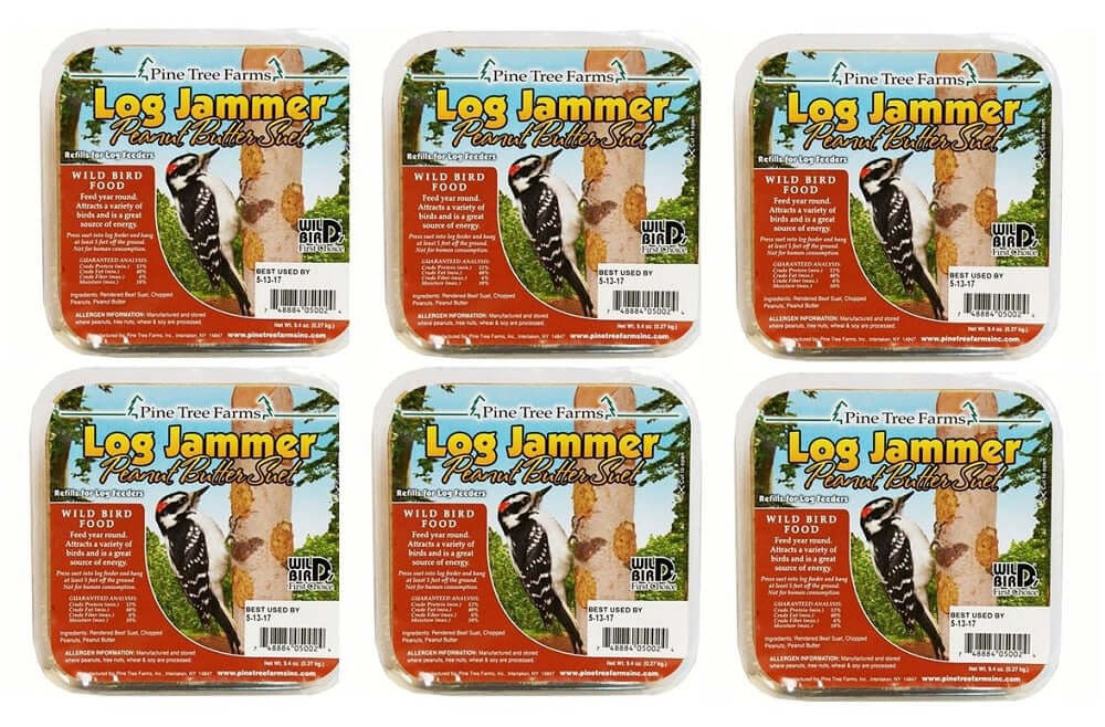 Pine Tree Farms Log Jammer Peanut Butter Suet six-pack featuring a Downy Woodpecker on a birch tree with peanut butter suet, showcasing vibrant colors and detailed bird imagery.