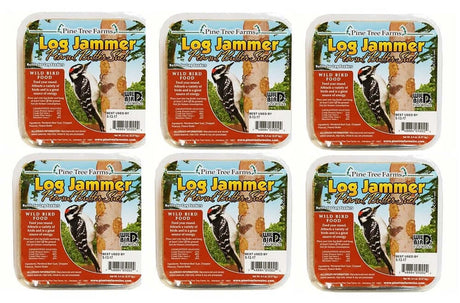 Pine Tree Farms Log Jammer Peanut Butter Suet six-pack featuring a Downy Woodpecker on a birch tree with peanut butter suet, showcasing vibrant colors and detailed bird imagery.