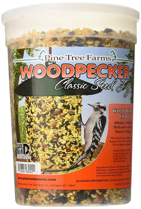 Pine Tree Farms Woodpecker Seed Log in a container, filled with mixed nuts and seeds for wild birds.
