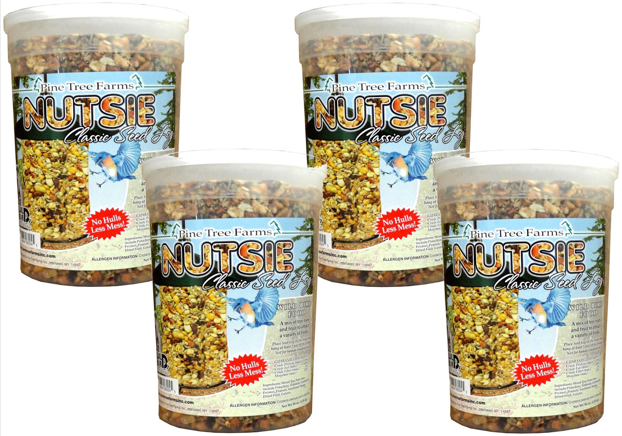 Pine Tree Farms Nutsie Classic Seed Log wild bird food featuring a vibrant bluebird a bird feeder filled with nuts seeds and dried fruit in clear plastic containers with a no hulls less mess label