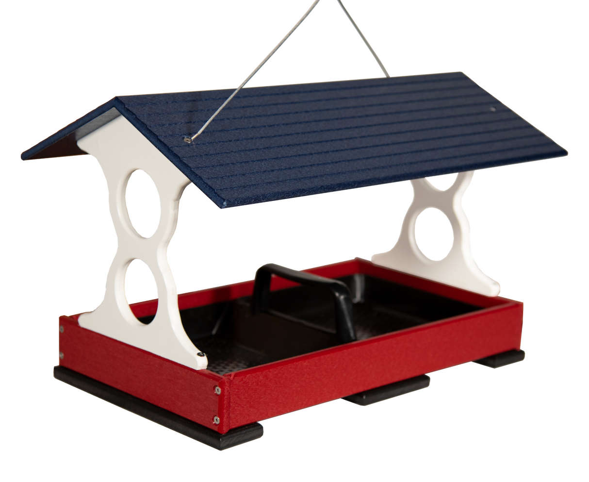 Unknown artist's red and navy blue bird feeder with a white frame, featuring a protective roof and small feeding holes, against a white background
