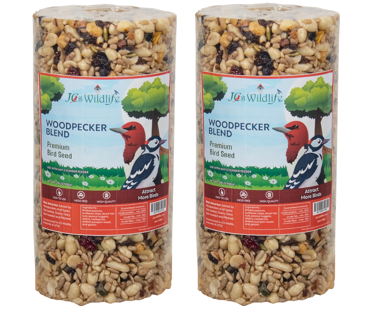 JCS Wildlife Woodpecker Blend premium bird seed in a clear cylinder package shows a red-bellied woodpecker, peanuts, sunflower seeds, and cranberries.