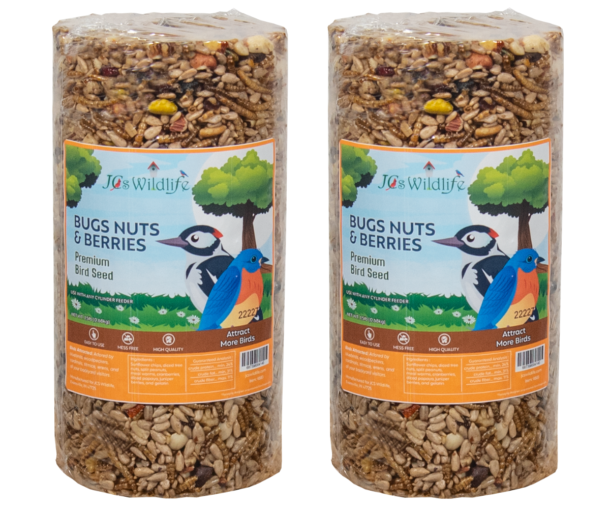 JCS Wildlife Bugs Nuts & Berries premium bird seed product featuring a woodpecker and bluebird against a tree backdrop showcasing sunflower seeds, dried cranberries, and mealworms