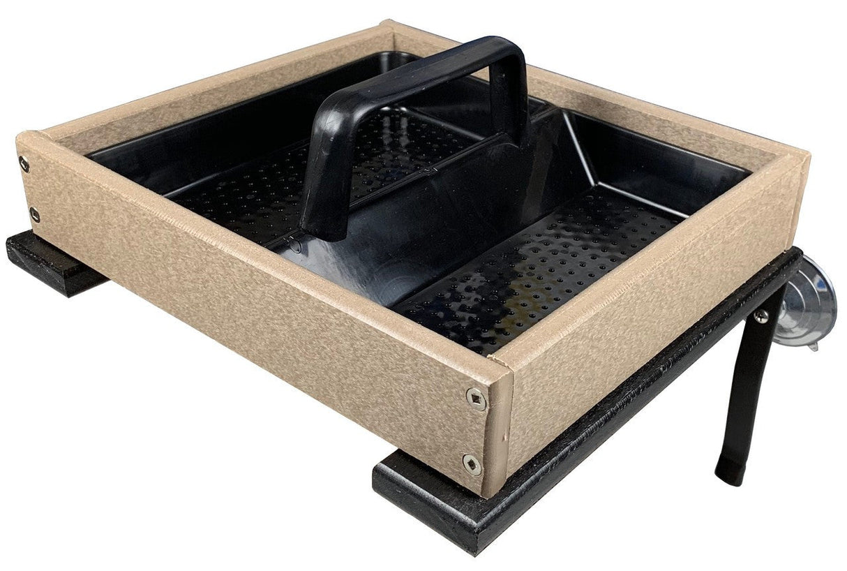 Product shot of a tan and black plastic bird feeder with a removable tray and suction cup mount showing textured surface, perforated insert, and sturdy handle