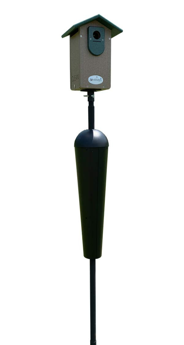 A J&L Wildlife birdhouse with a green roof and taupe body mounted on a black pole with a predator guard featuring a clean design and a circular logo