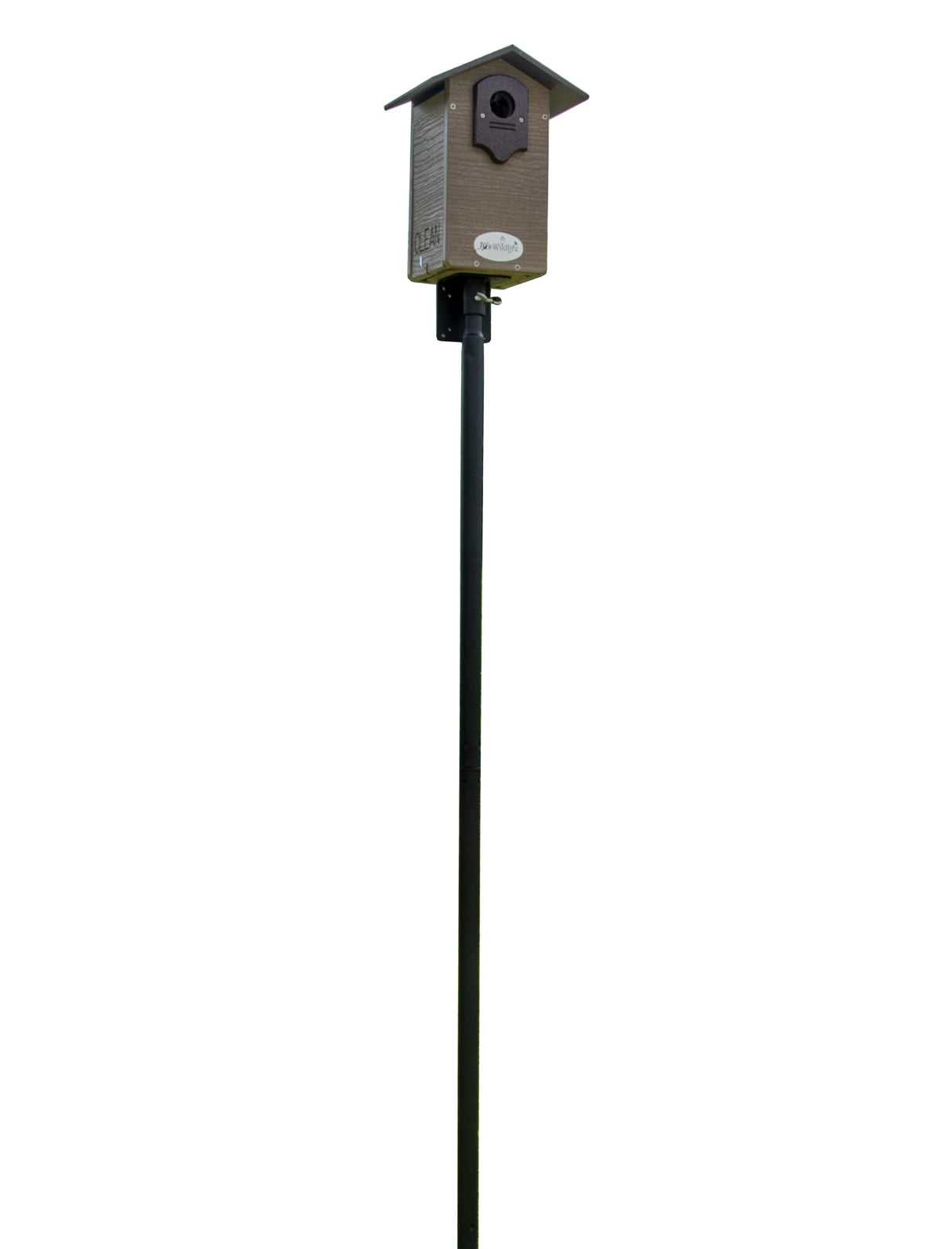 Wildlife camera image of a brown and gray birdhouse mounted on a tall black pole featuring a dark roof and a circular entry hole against a white background
