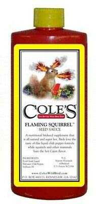Product shot of Cole's Flaming Squirrel Seed Sauce a red bottle featuring a cartoon squirrel with fiery ears against a yellow label with vibrant red and green accents