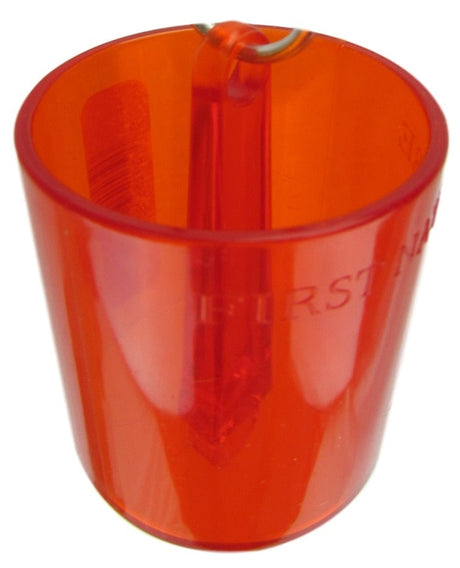 Plastic translucent orange cylindrical container with a small internal pointed object and partially visible text on the side a bright reflective surface and a metallic loop at the top