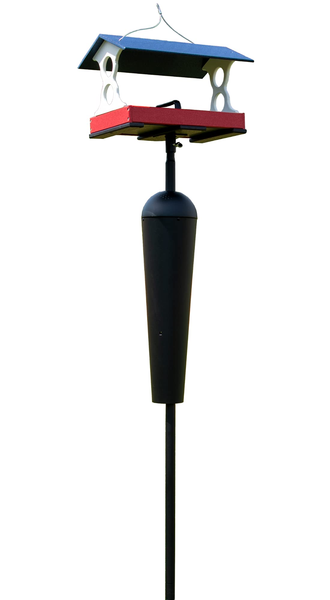 Plastic bird feeder with red tray blue roof and black reservoir on a tall black pole against a white background