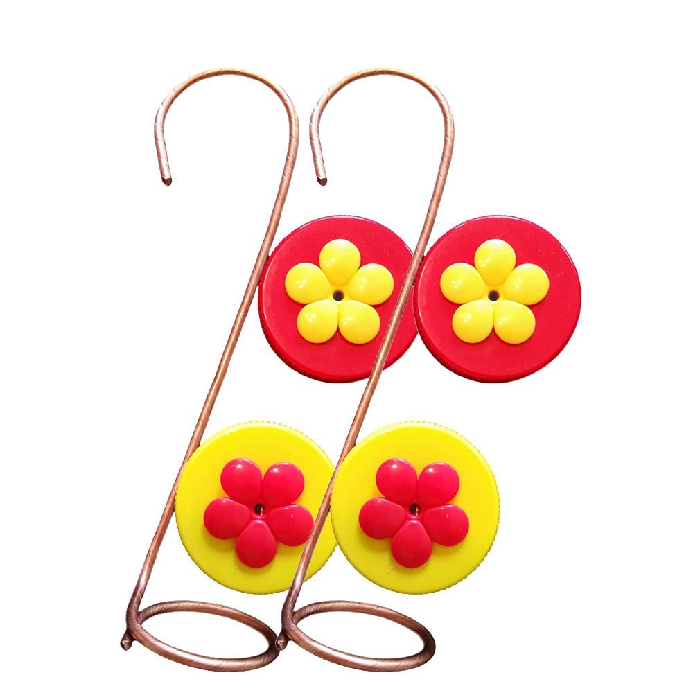 Unknown artist handmade copper wire hummingbird feeder featuring vibrant red and yellow flower accents on bottle cap bases