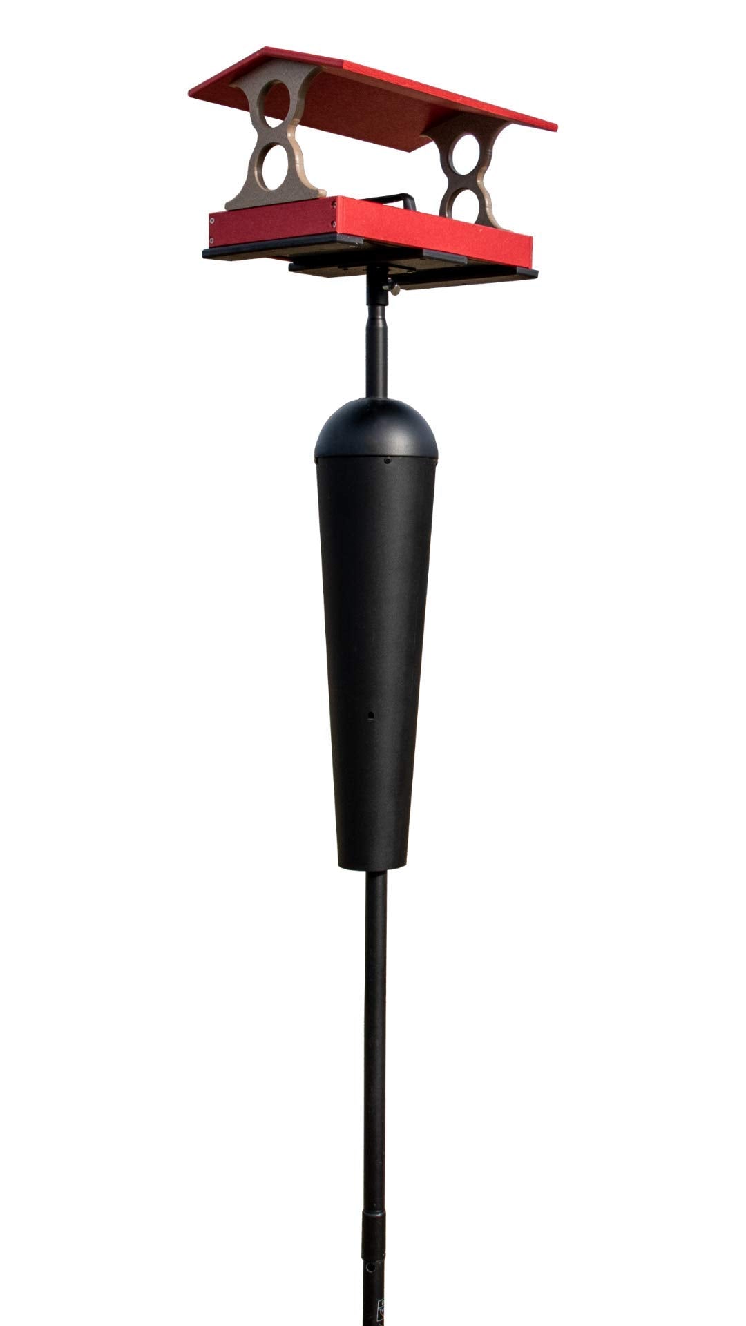 Product shot of a red and black recycled plastic bird feeder with a gray roof and squirrel baffle on a black pole against a white background