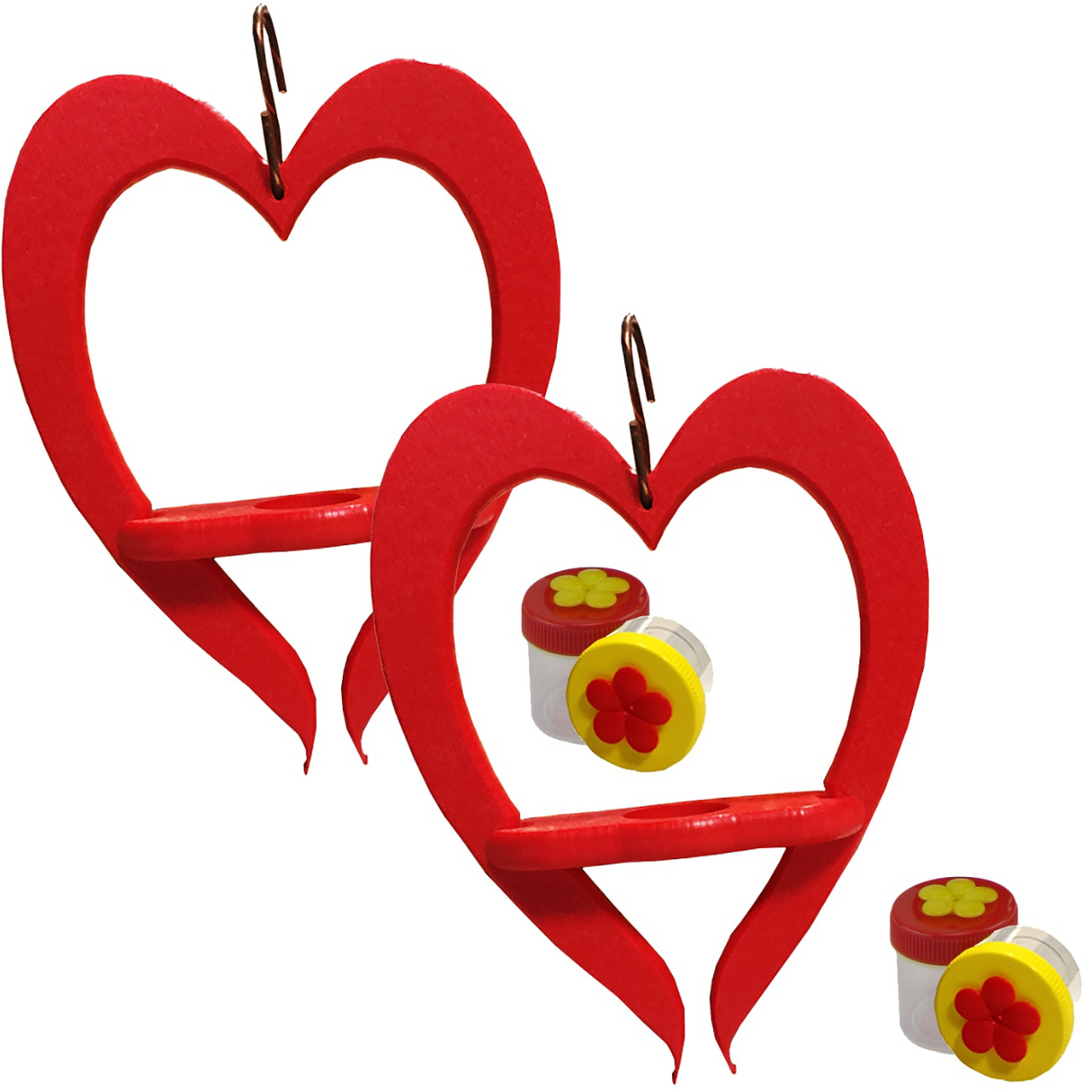 Two red heart-shaped bird feeders with small shelves and accompanying red and yellow flower-shaped containers on a white background