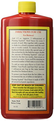 Product shot of Flaming Squirrel Seed Sauce, a red bottle with yellow label, showing directions for birdseed and warnings about chili pepper irritants.