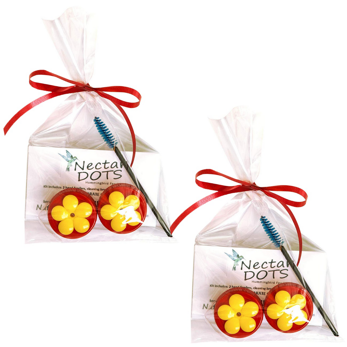 Product photography showing two Nectar Dots hummingbird feeder kits each containing two red and yellow flower-shaped feeders a cleaning brush and a red ribbon