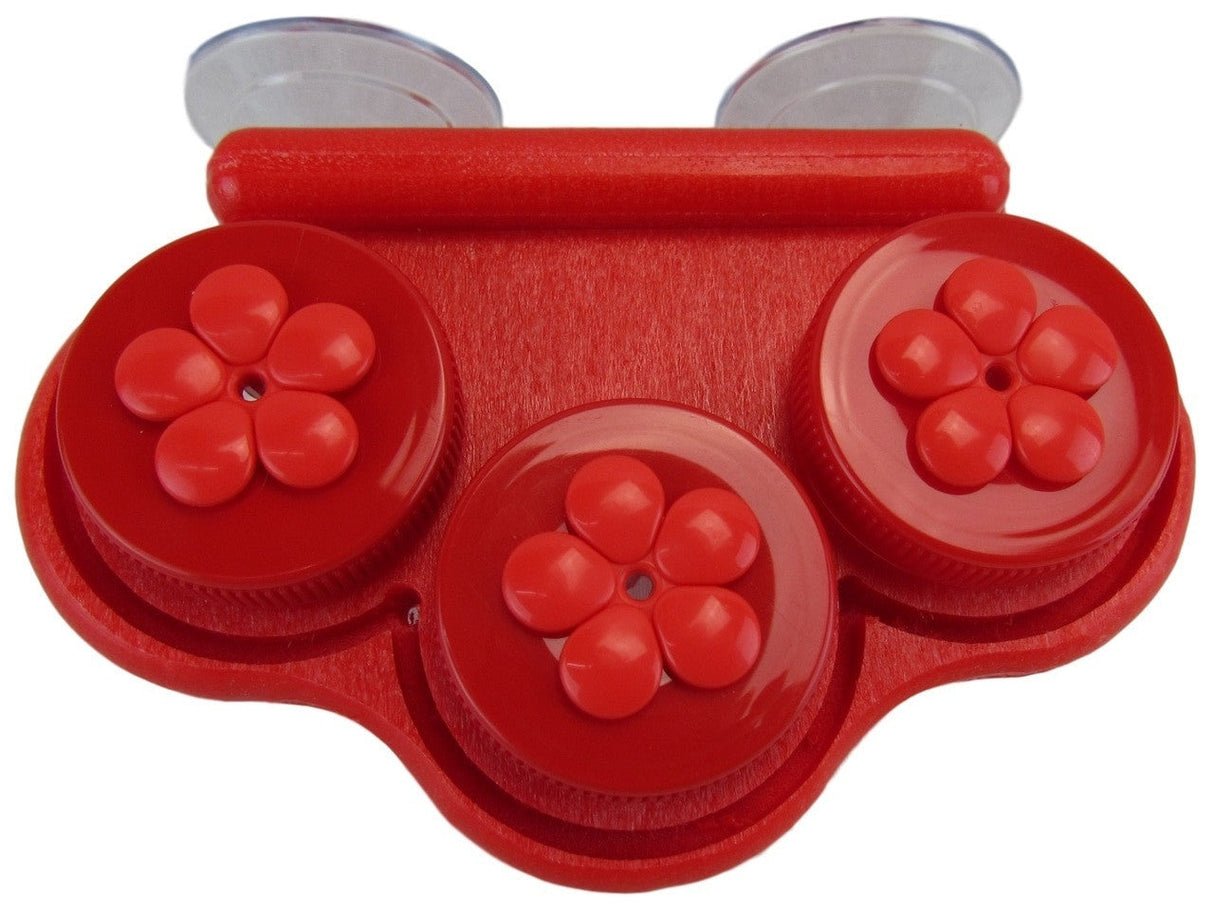 Plastic red suction cup organizer with three flower-shaped compartments and textured surface