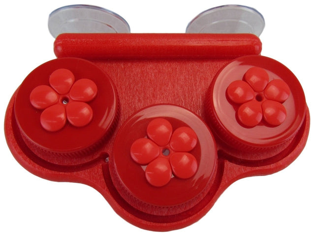 Plastic red suction cup organizer with three flower-shaped compartments and textured surface