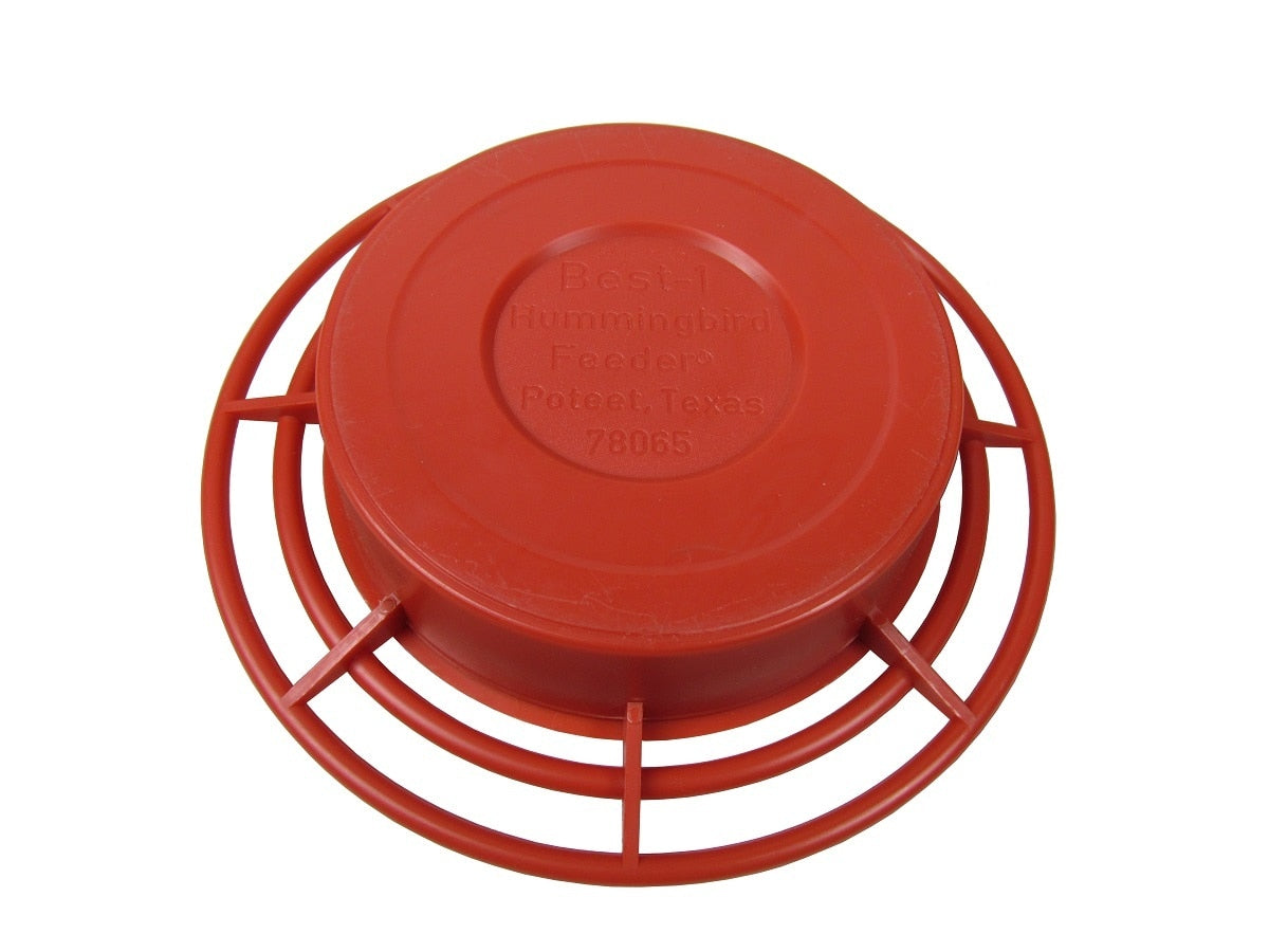 Plastic Best-1 Hummingbird Feeder from Poteet Texas showing a vibrant red color a circular design and embossed text