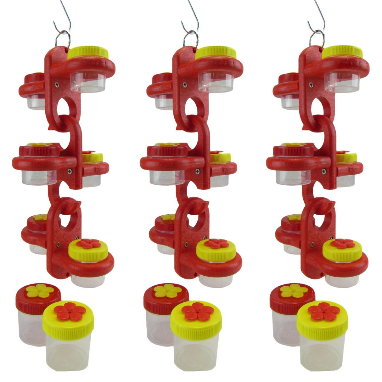 Plastic hummingbird feeder with three red tiered sections, yellow and red flower-shaped lids, and clear containers showing against a white background