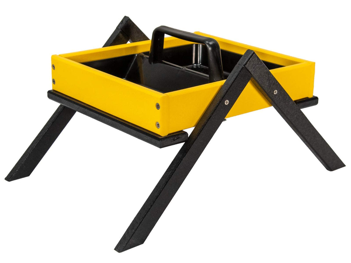 Plastic bird feeder with a bright yellow tray black legs and a built-in handle showcasing visible screws and a textured base