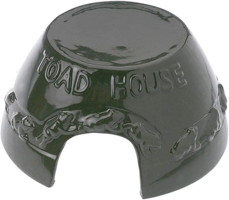 Ceramic toad house garden ornament featuring a dark green glaze toad silhouettes and the words Toad House embossed on the top