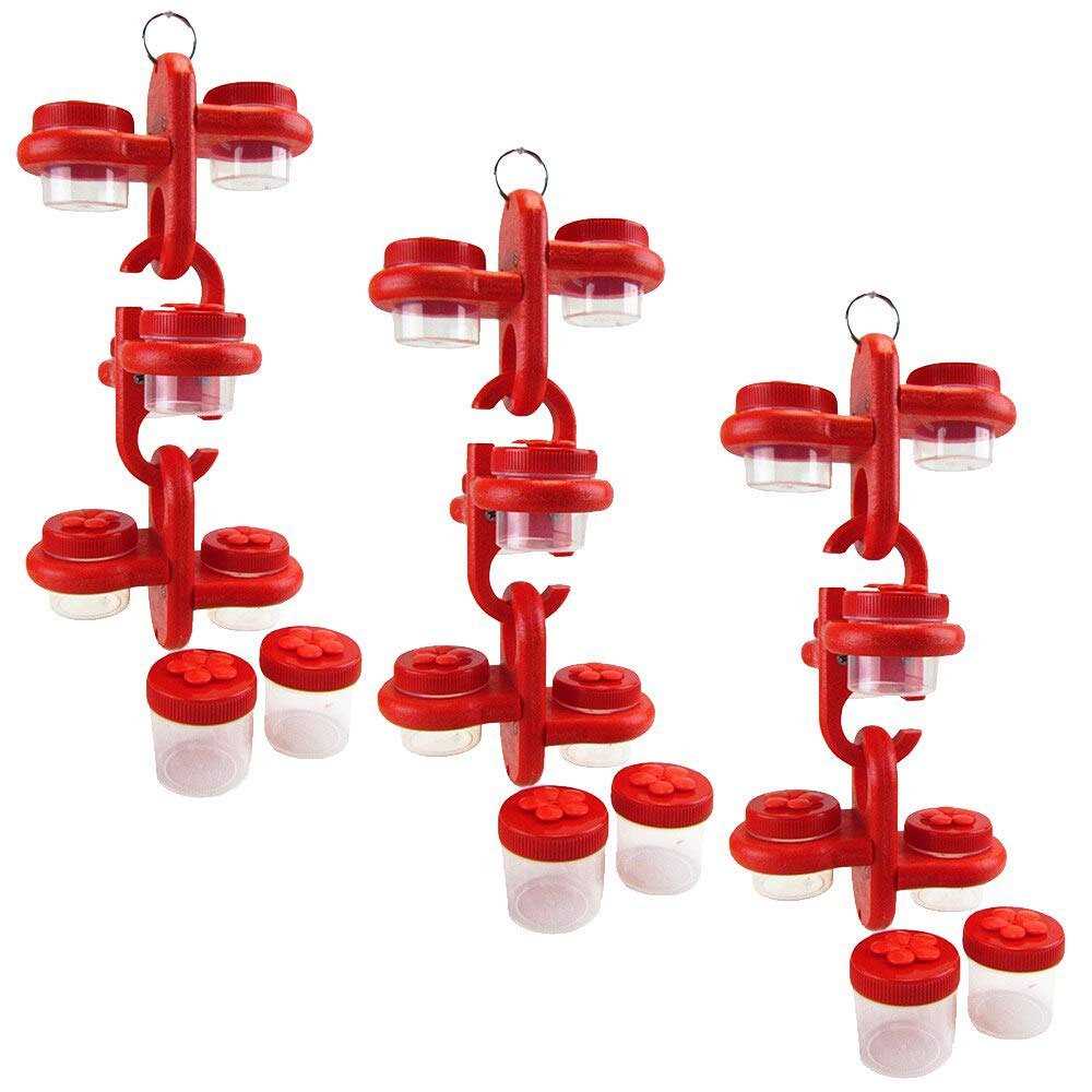 Product shot of three red plastic spice racks with clear containers showing vibrant red lids and flower-shaped detailing on the smaller containers against a white background
