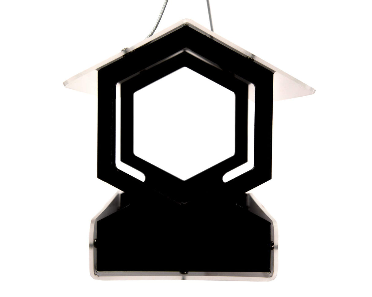 Product shot of a black and clear acrylic hexagonal bird feeder with a clear roof and hanging wire against a white background