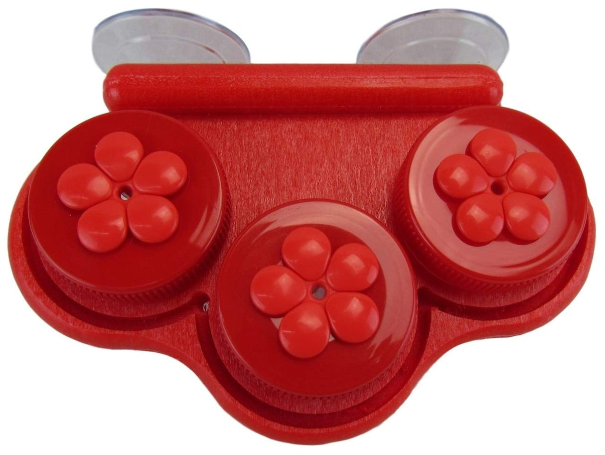Plastic red three-compartment suction cup organizer with flower-shaped details and glossy finish showing on a white background