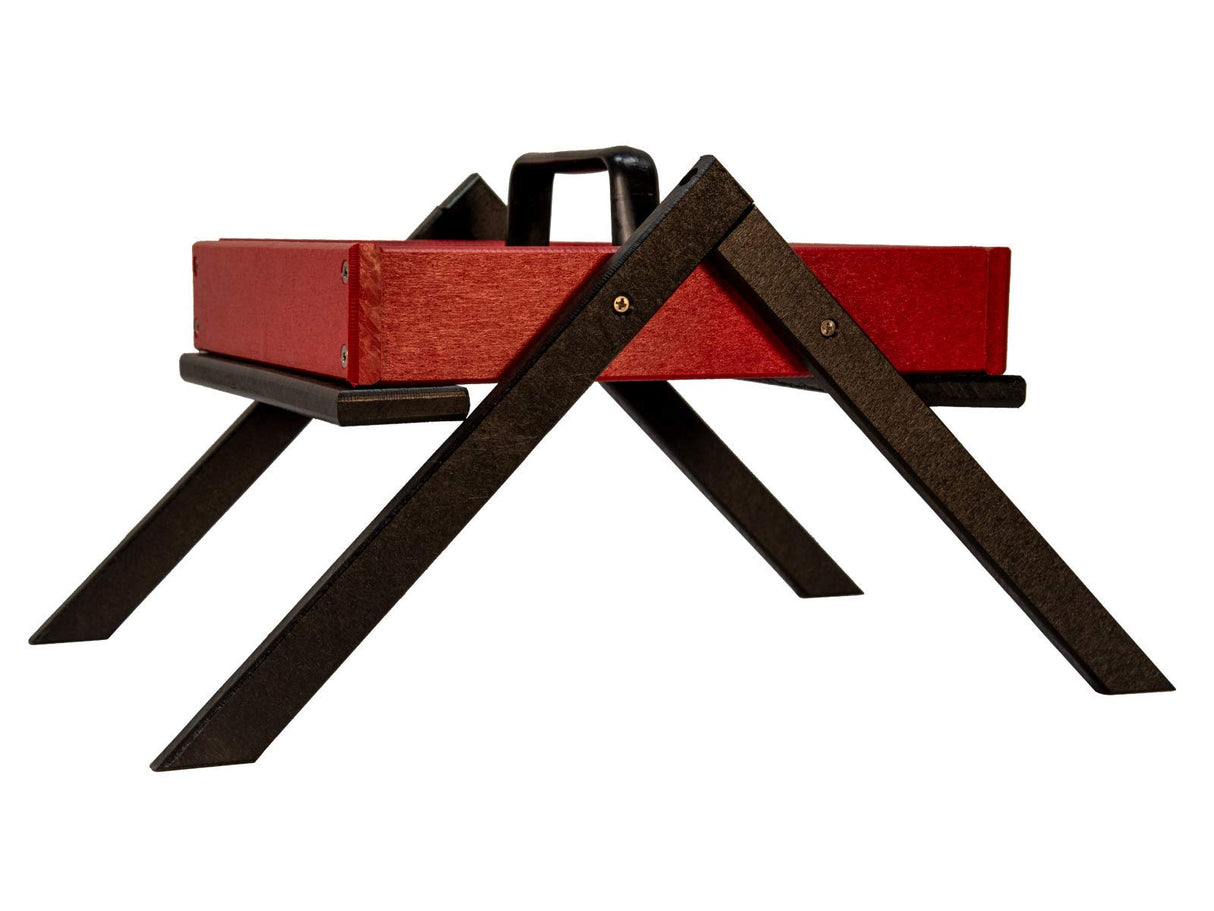 Studio shot of a red and black wooden tray with a handle and x-shaped legs featuring visible wood grain texture, brass-colored screws, and a sleek modern design