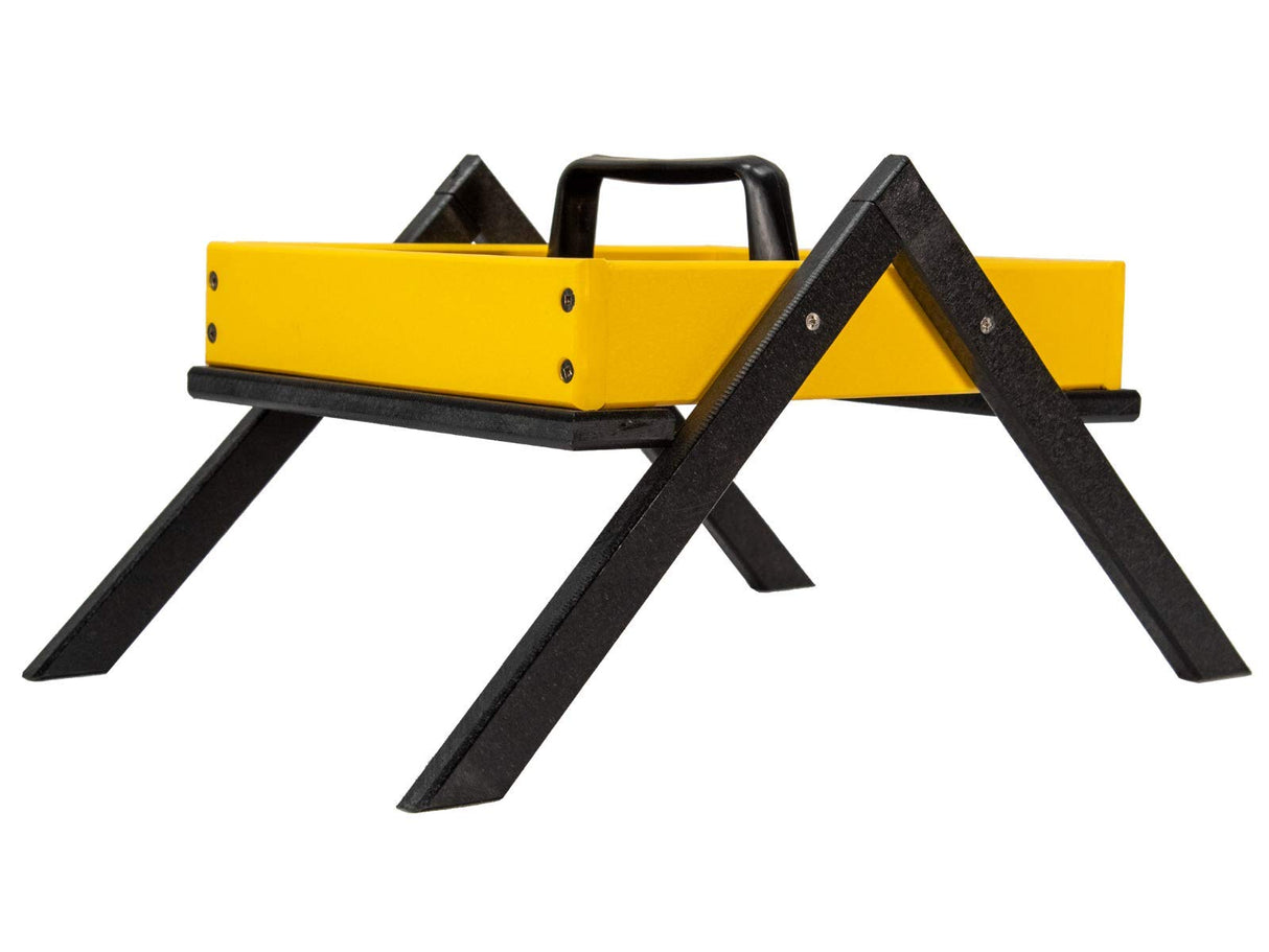 Product shot of a yellow tray with black legs and a handle showing visible screws and a textured black base.