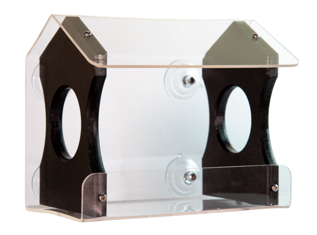 Acrylic bird feeder with dark wood accents and clear protective roof showing suction cups and small screws in a modern design