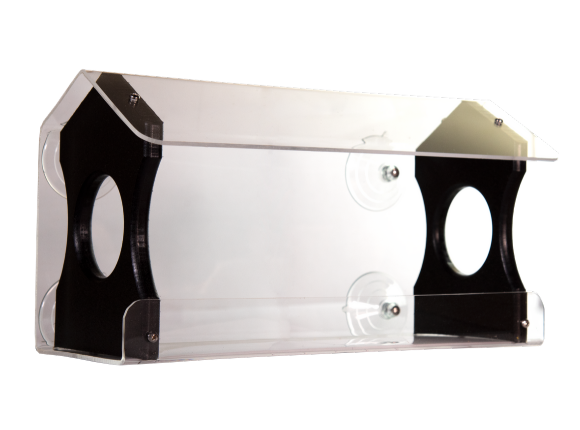 Product shot of an acrylic and black plastic bird feeder with suction cups clear roof and two feeding holes