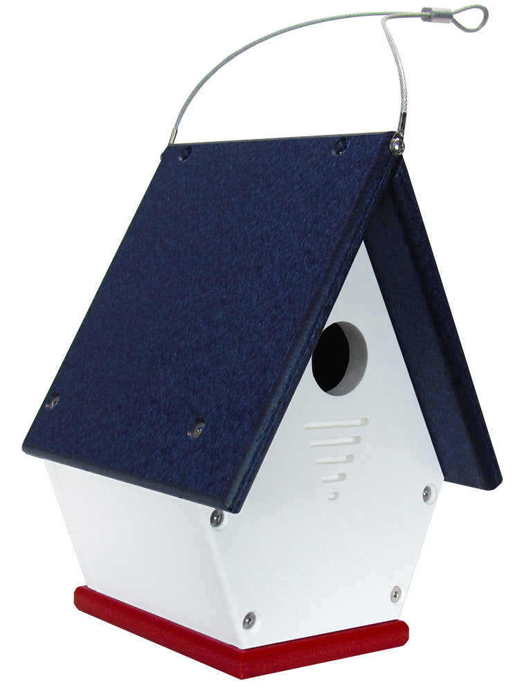 Plastic birdhouse with a navy blue roof, white walls, and red base featuring a hanging wire and ventilation slots