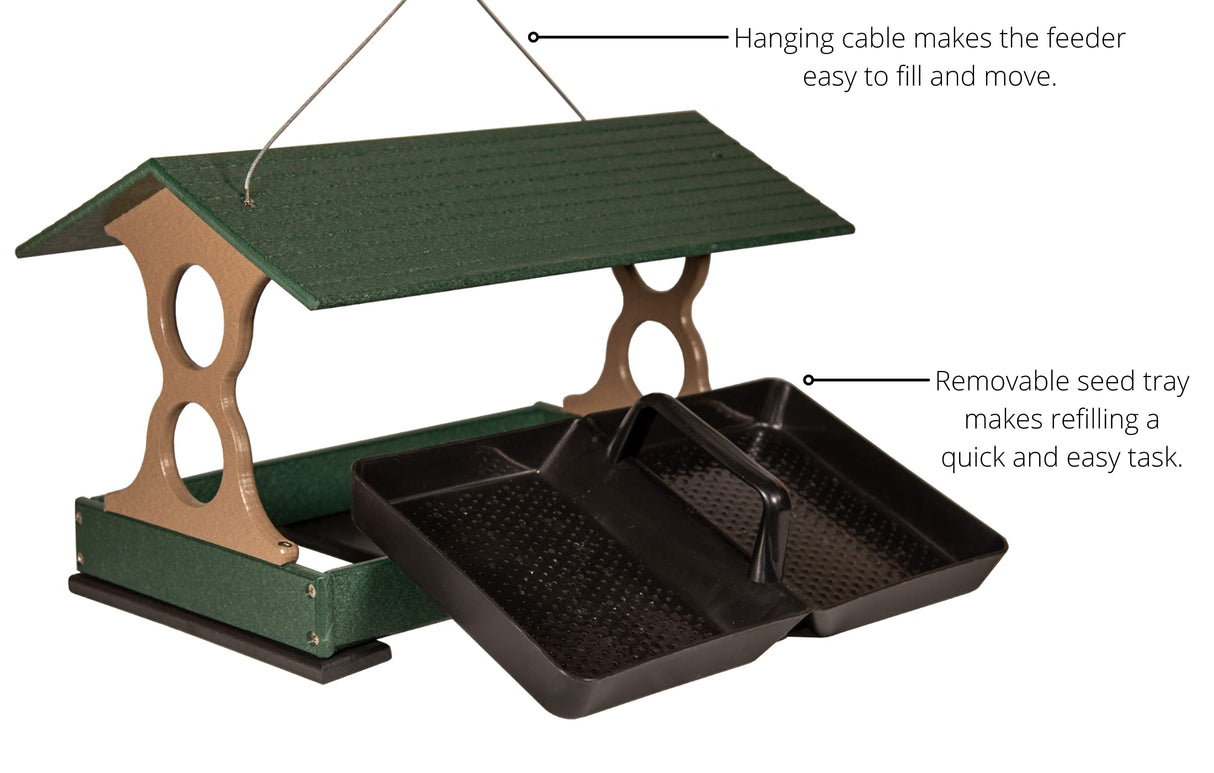 Product shot of a green and tan plastic bird feeder with removable black seed trays and a hanging cable showing a textured roof and convenient handles