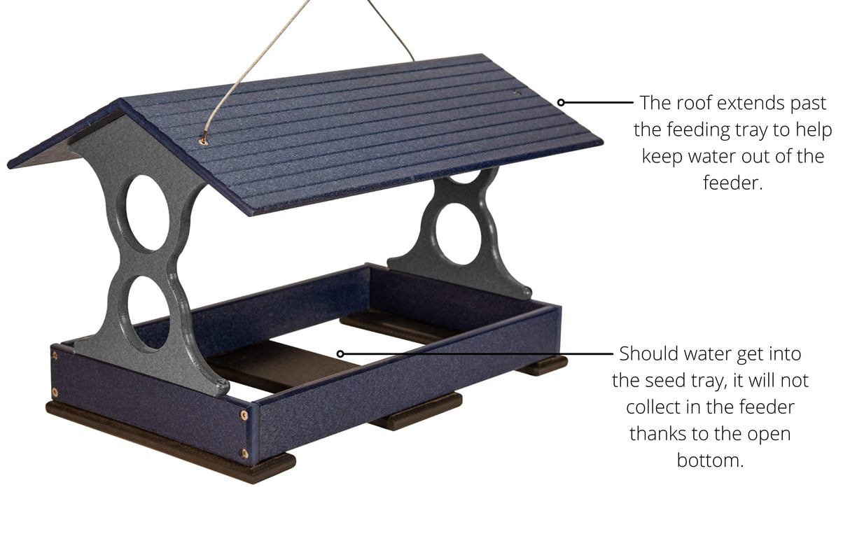 Plastic bird feeder with dark blue and gray speckled finish showing a protective roof, open bottom, and small feet for easy hanging