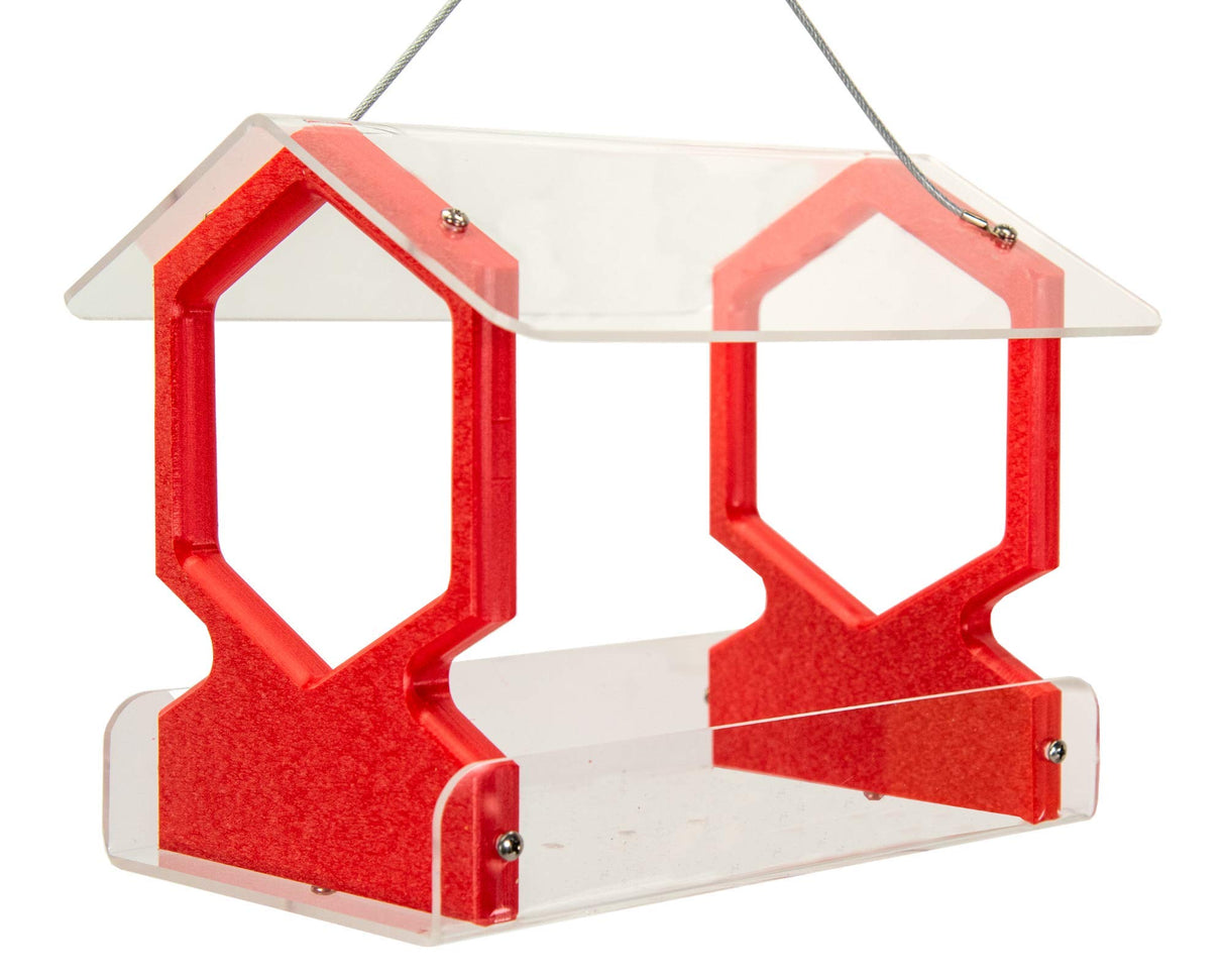 Product shot of a red and clear acrylic bird feeder with a house-shaped top featuring hexagonal cutouts and small silver screws for detail.