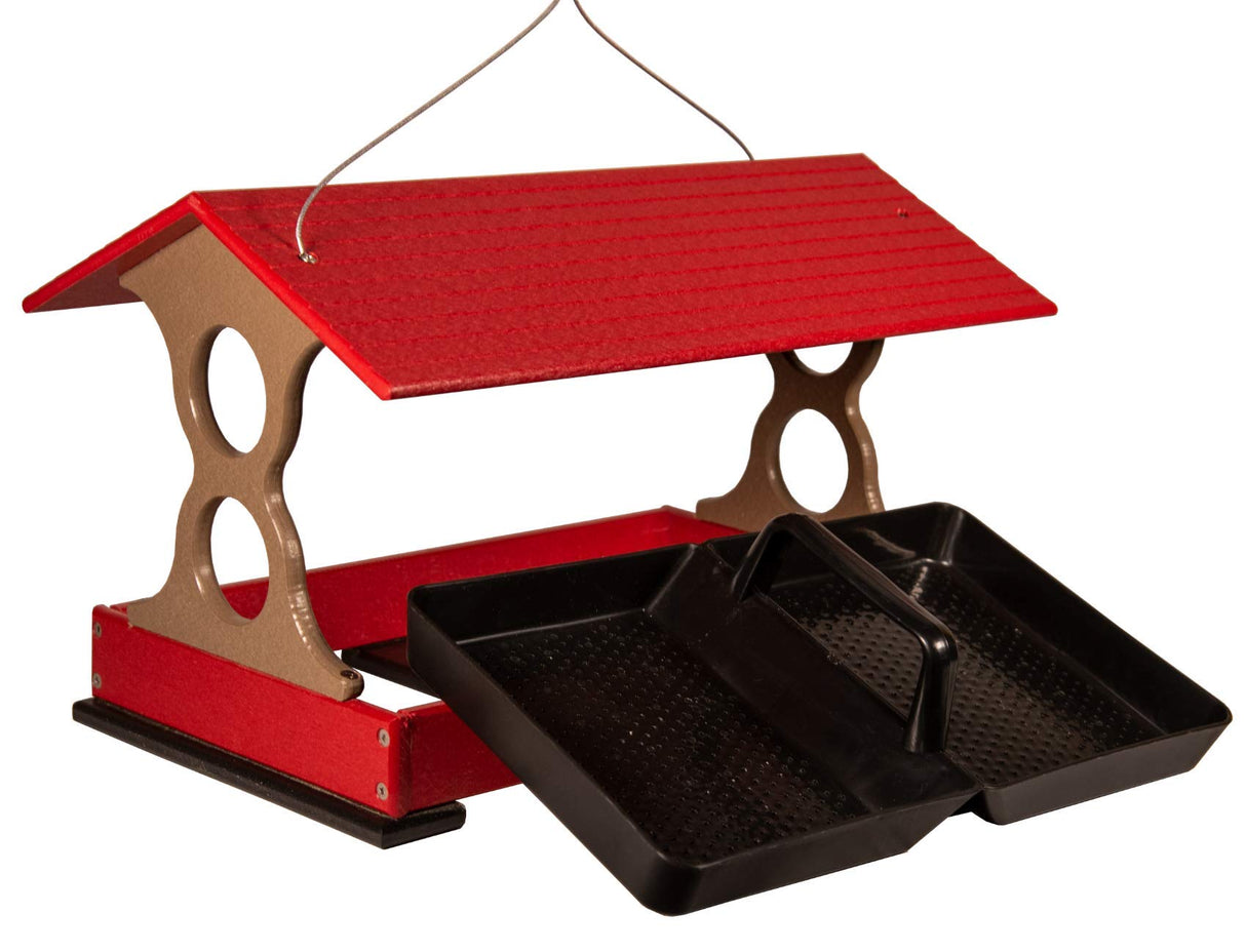 Plastic red and taupe bird feeder with two black trays showing textured surfaces and a wire hanging system against a white background