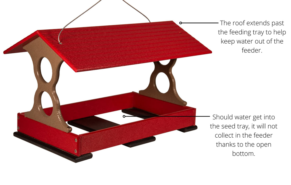 Product Photography: Red and taupe recycled plastic bird feeder with a red roof, hanging from a wire, featuring an open bottom and protective overhang